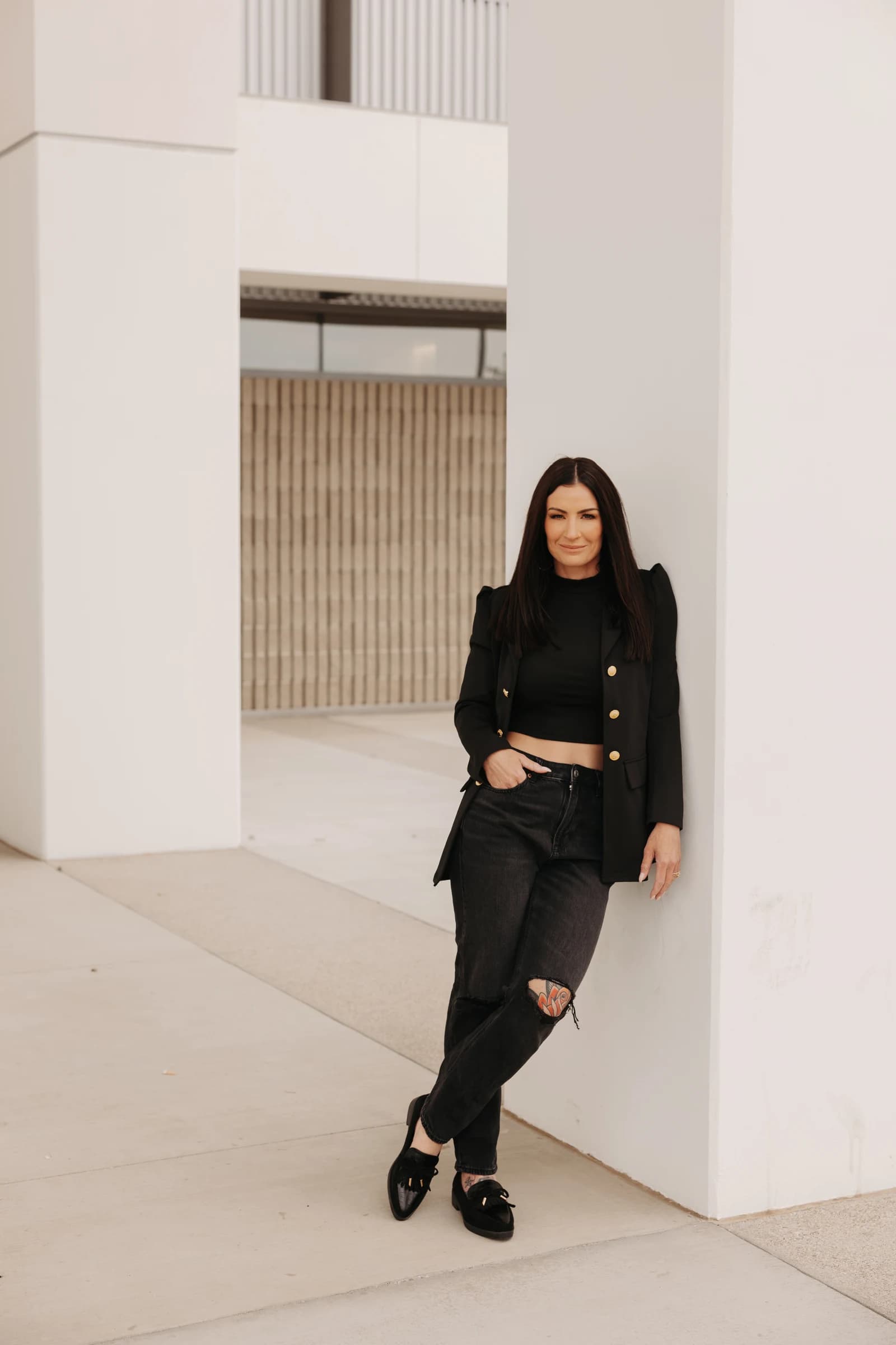 Amanda Fritscher standing in a modern architectural setting