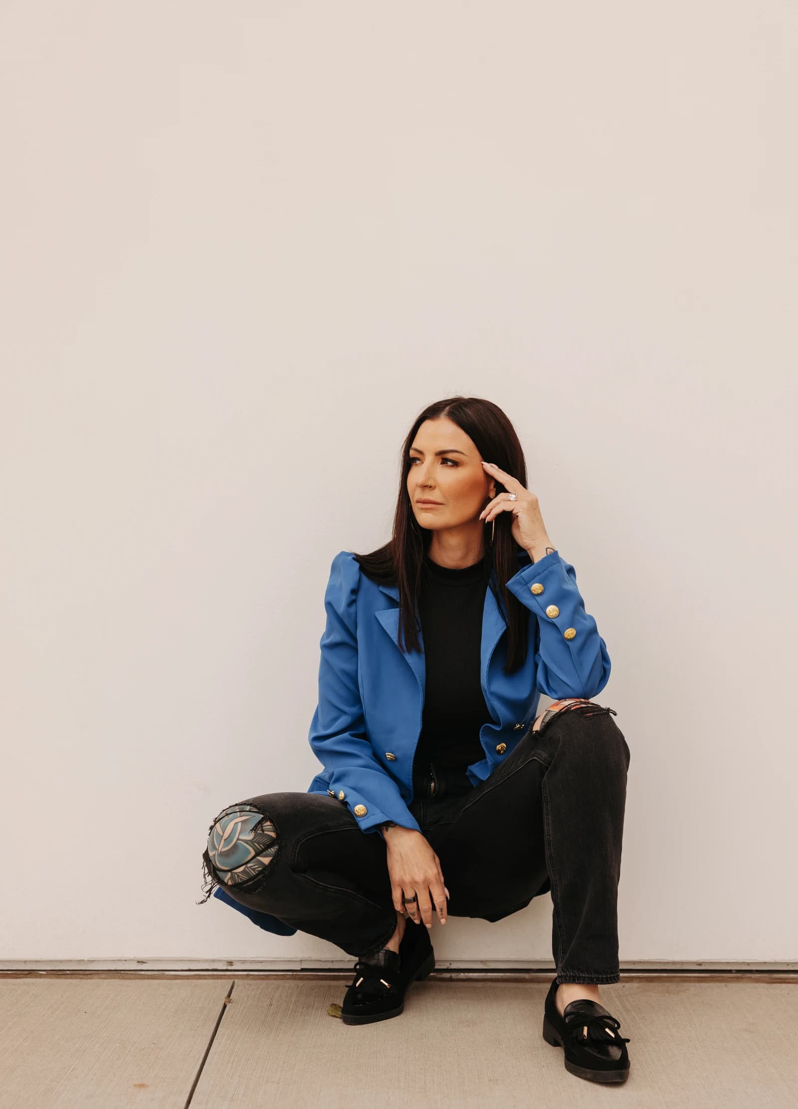 Amanda Fritscher seated in a blue blazer